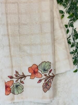 Checks organza sarees with applique
work and floral blouse