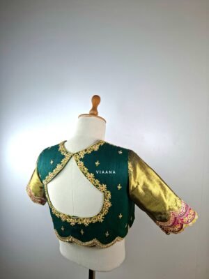 Gold and silver Zardozi filled floral work and scalloped burgundy patch sleeves with scallop cut on back