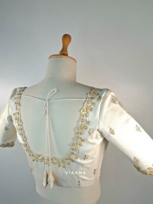 Gold and silver zari and knot embroidery with allover cutwork