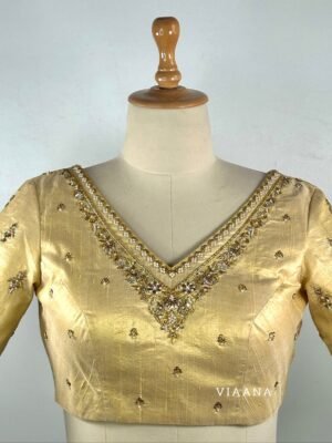 Luminous floral zardozi, sequins and peals used embroided gold shimmery blouse