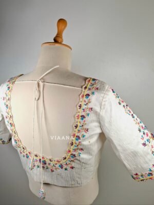 Multicolor thread and zari embroided with allover cutwork white blouse