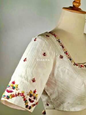 Multicolor floral embroidery with unique sleeves designed white blouse